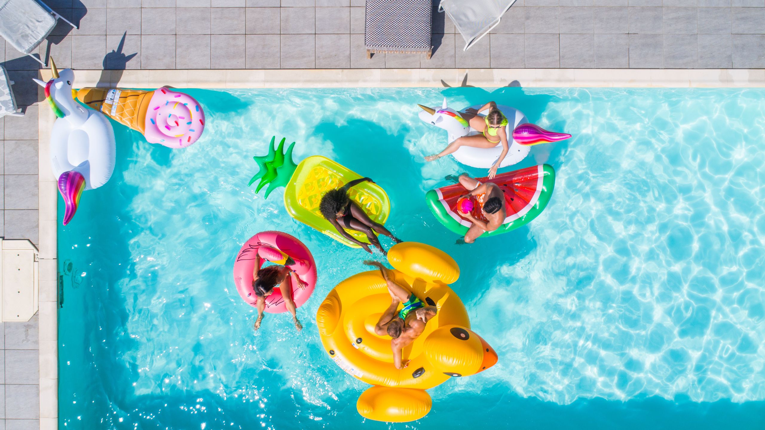 Friends having fun in a swimming pool